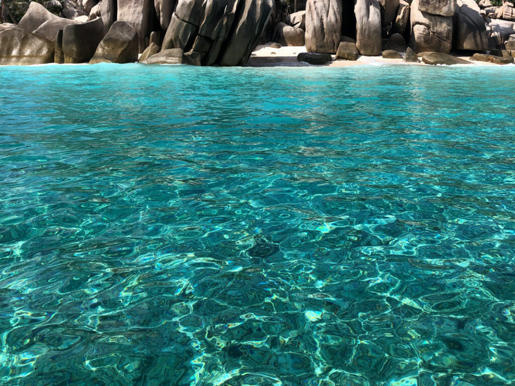 Flying by boat over crystal clear turquoise water is an experience