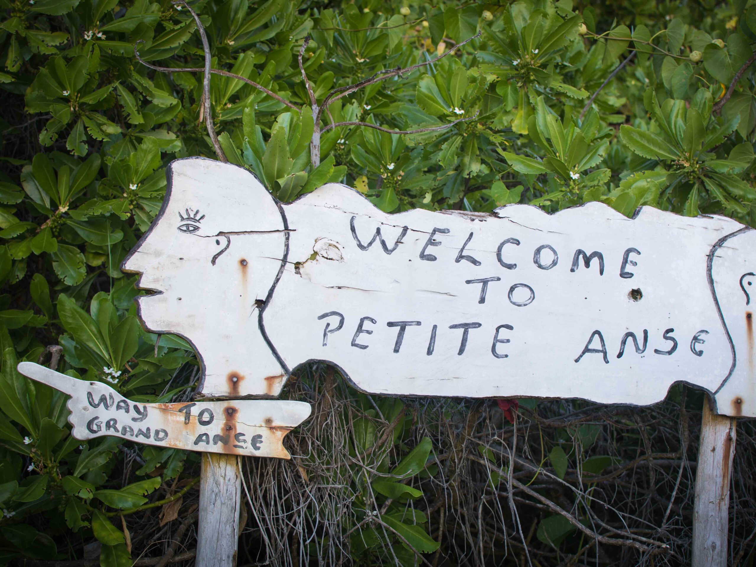 Signpost on Petite Anse beach